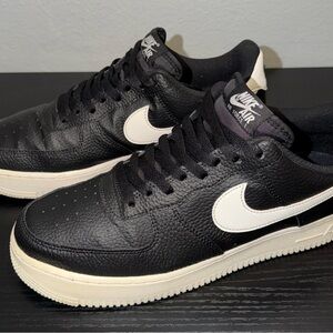 Nike Black Leather Low-Top Sneakers with White Swoosh